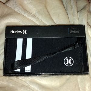 Brand new Hurley wallet with clutch strap